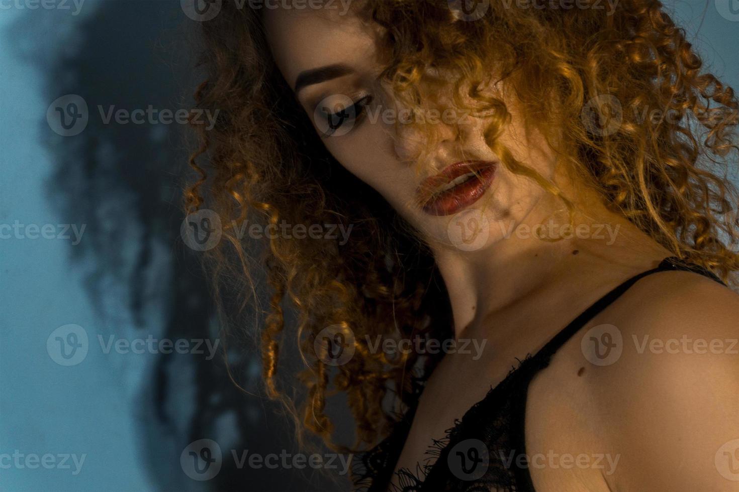 portrait of sexual curly girl with dark lipstick photo