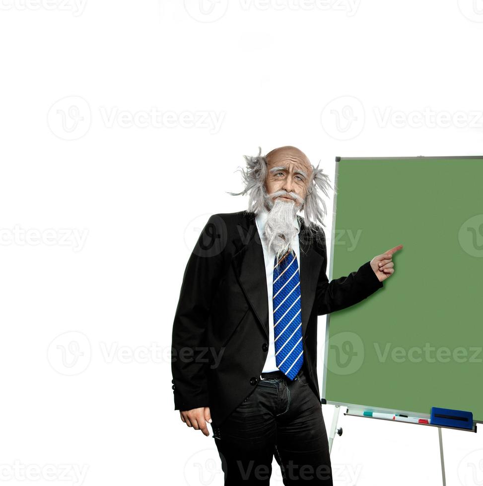 old grayhead teacher points to the blackboard photo