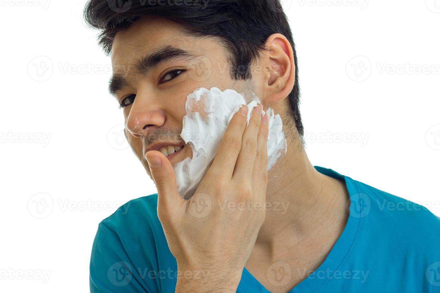 cute guy putting a foam face before shaving photo