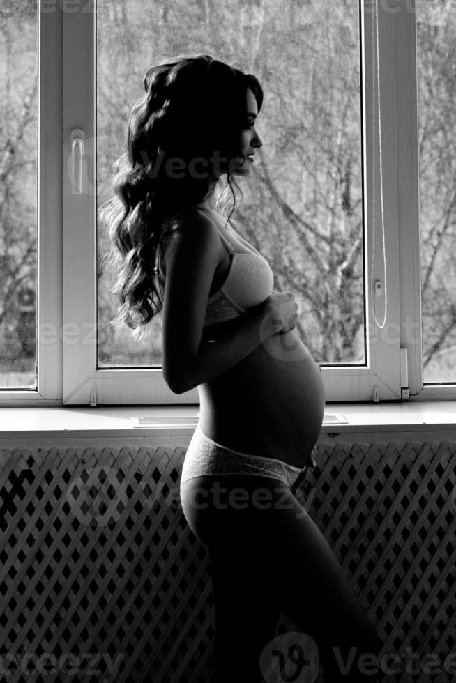 Silhouette beautiful pregnant girl photo