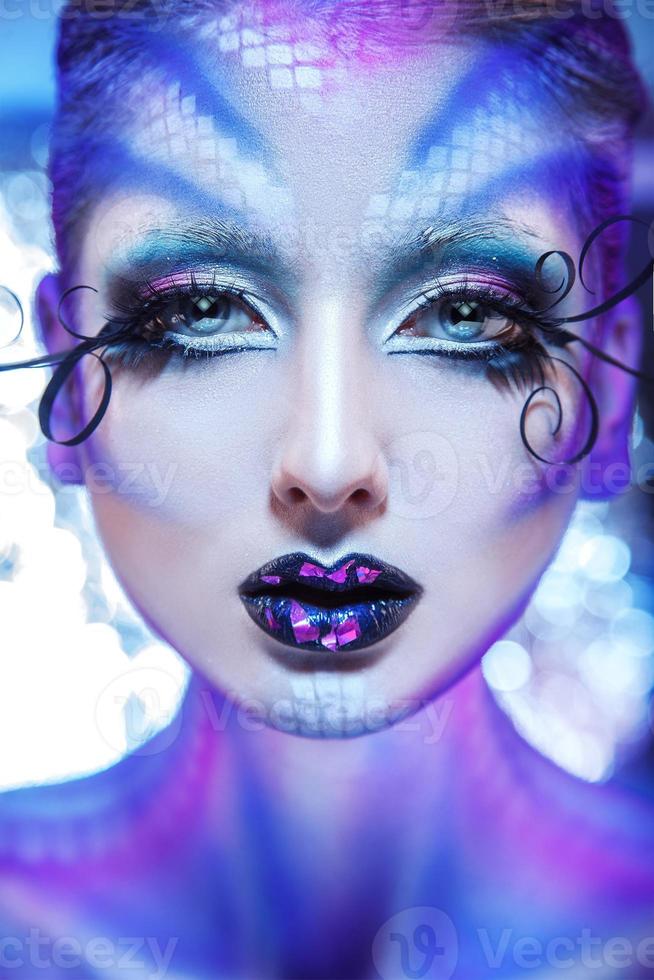 Vertical photo of fashionable model with creative make up