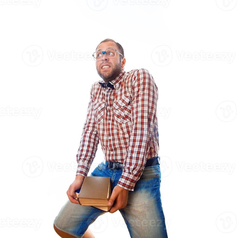 nerd guy carries heavy burden of knowledge in form of books photo