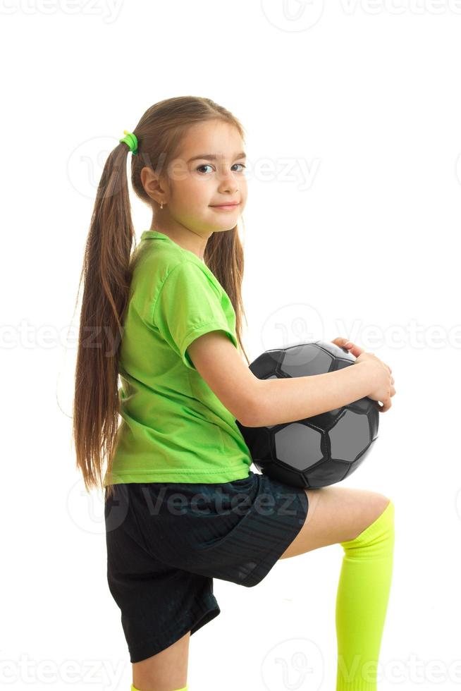 vertical portrait of cute little girls with tails and a ball in the hands of isolated on a white background photo