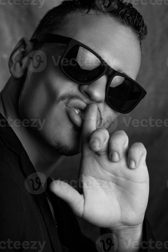 Black and white photo of glamour male in studio