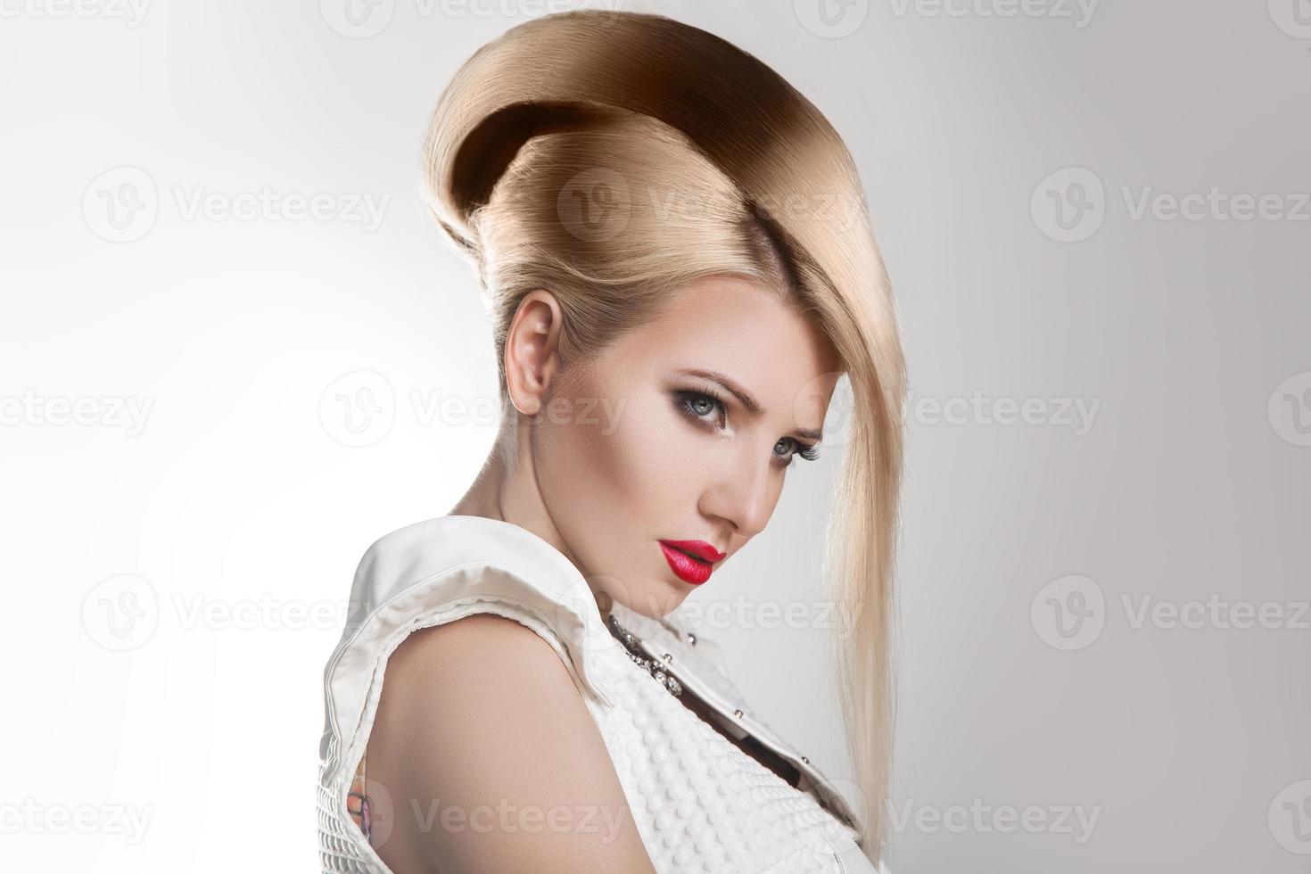 Haircut. Beautiful Girl with Healthy Short Blond Hair. Hairstyle photo