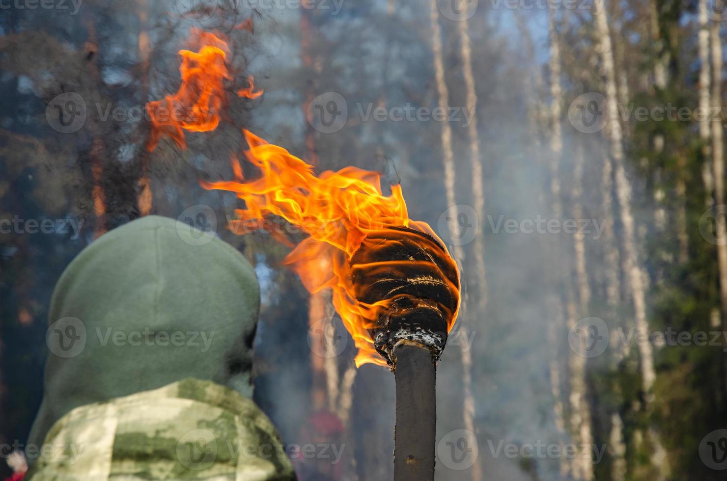 a burning torch for ignition. Flame on a homemade torch photo