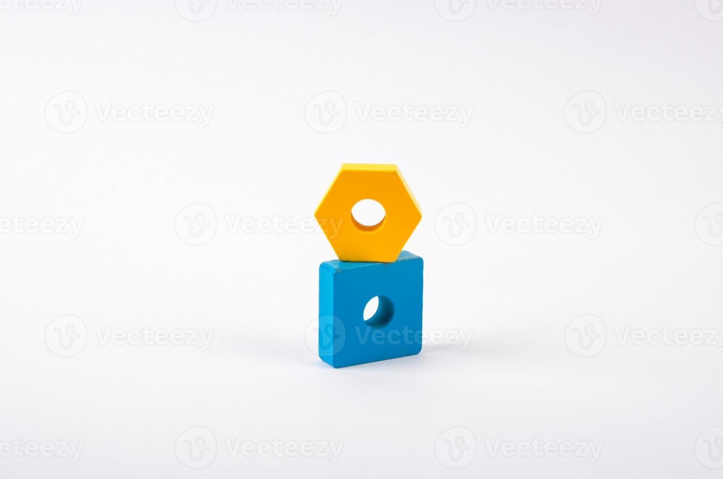 geometric shapes yellow and blue from toys on a light background photo