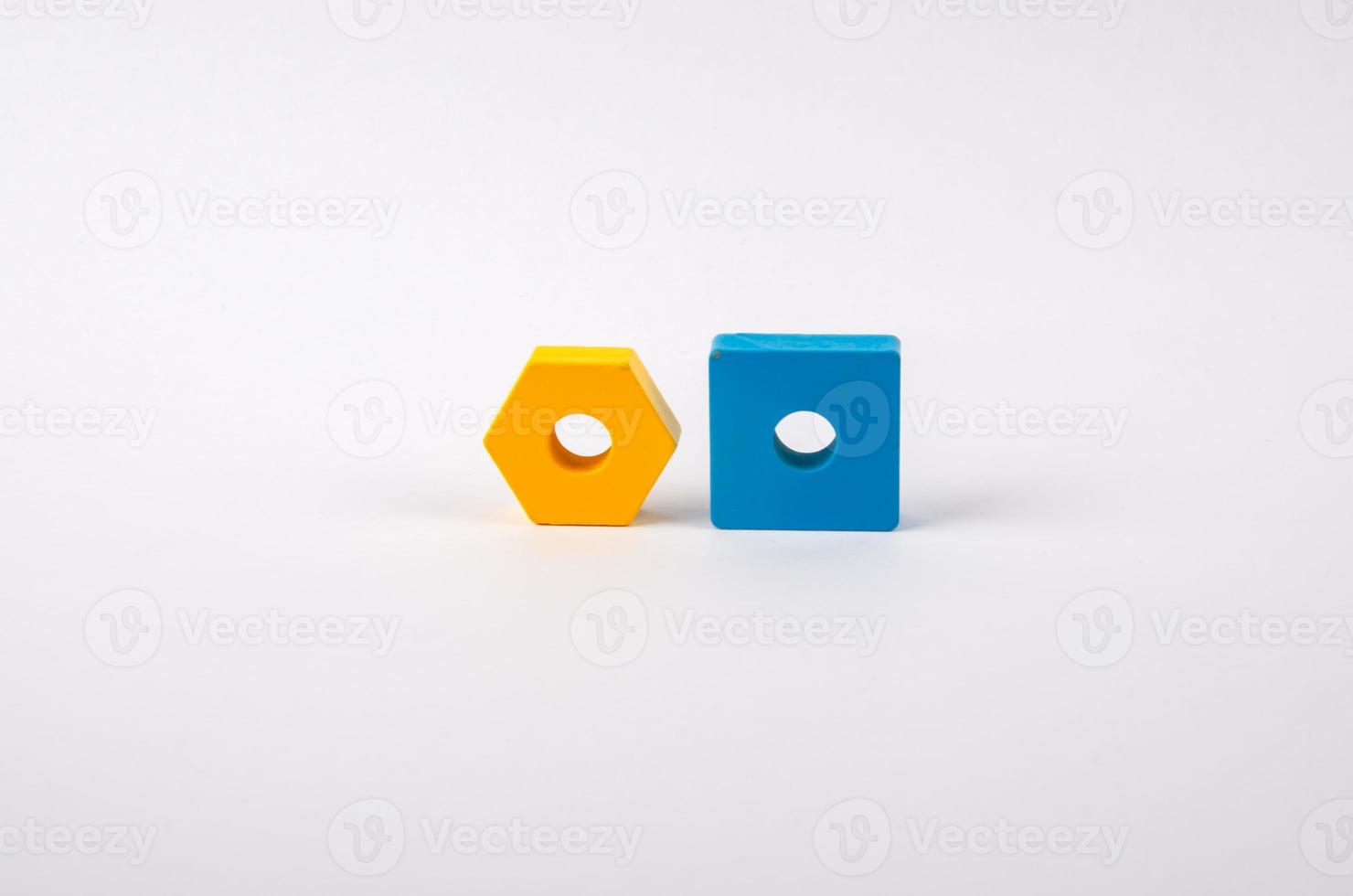 geometric shapes yellow and blue from toys on a light background photo