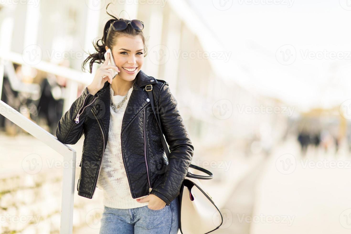 Young woman with mobile phone photo