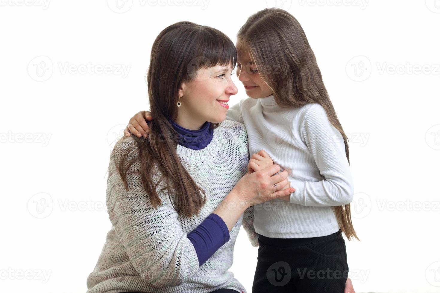 couple of mother with her daughter hugging and smiling photo