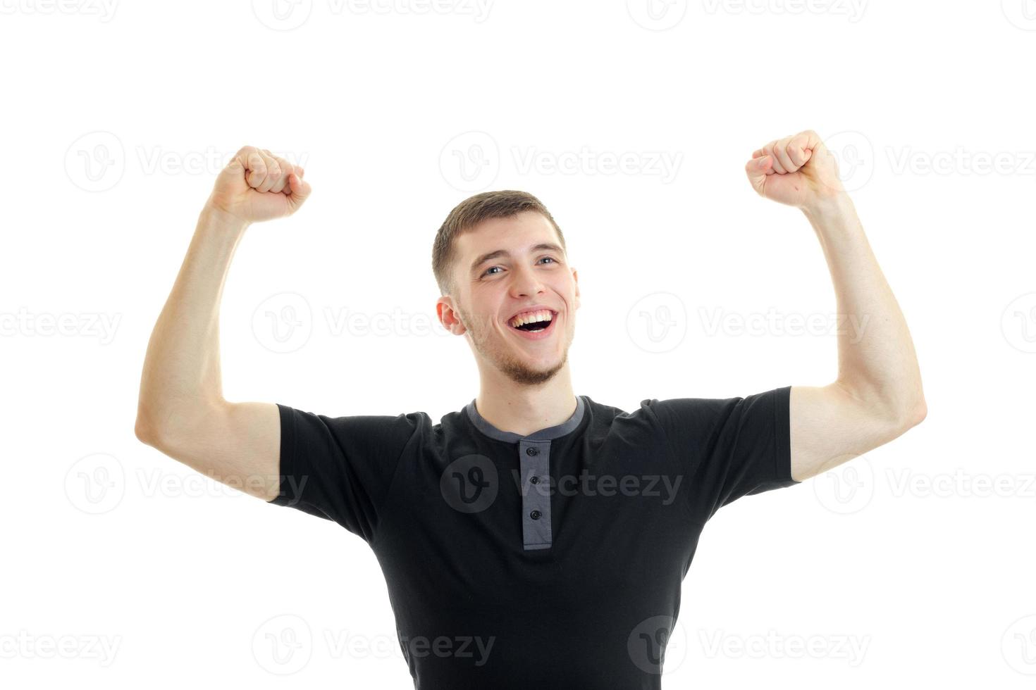 Portrait of a cheerful Sports Guy who raised two hands up isolated on a white background photo