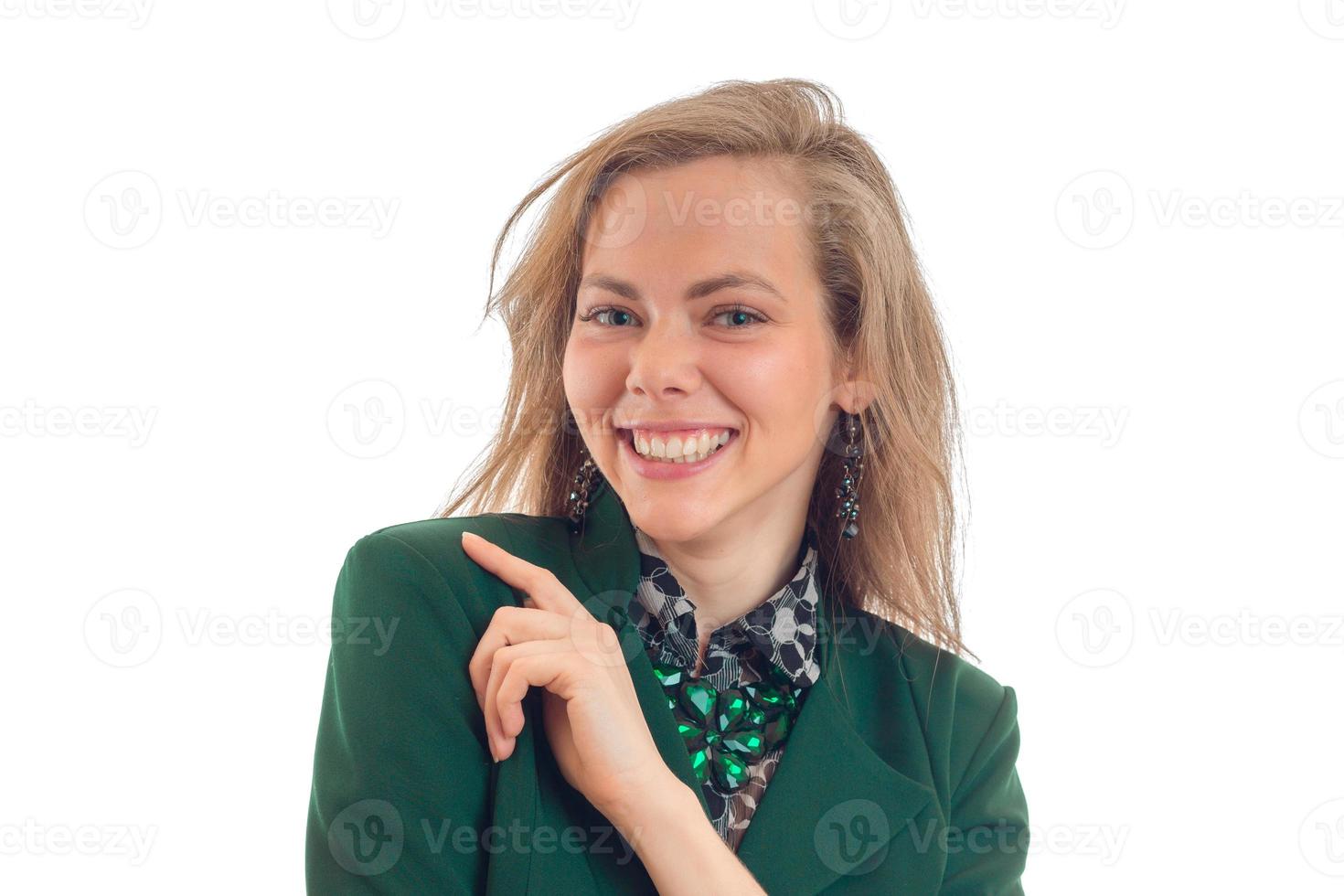 Portrait of a smiling young blond chic who looks into the camera and laughs close-up photo