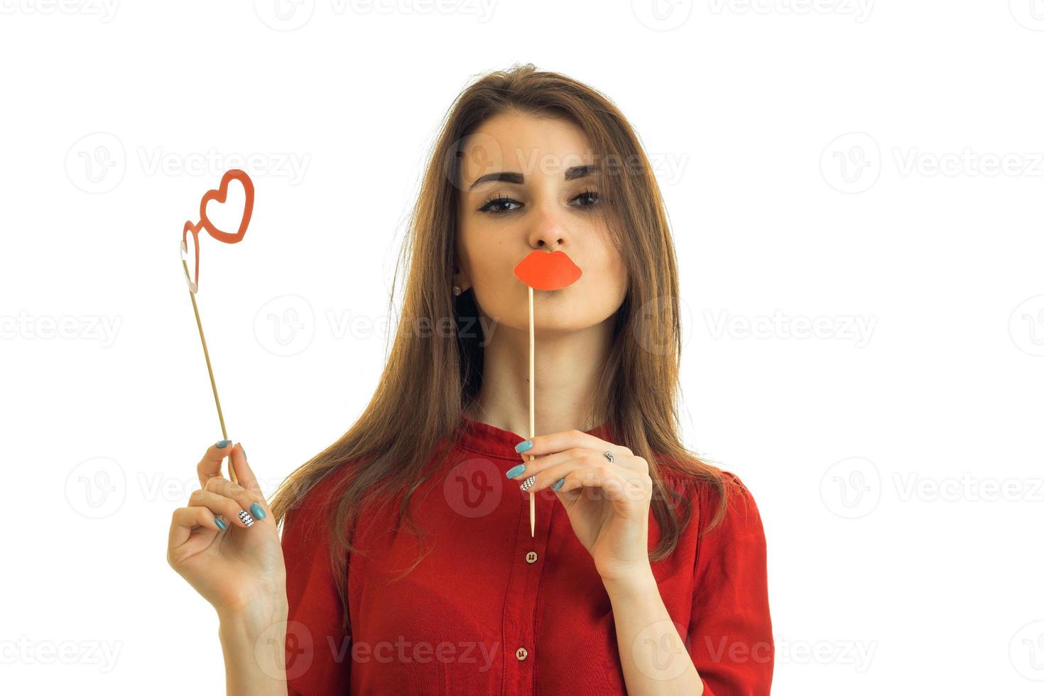 beautiful young girl looks into the camera and holds the paper Dummies for photo