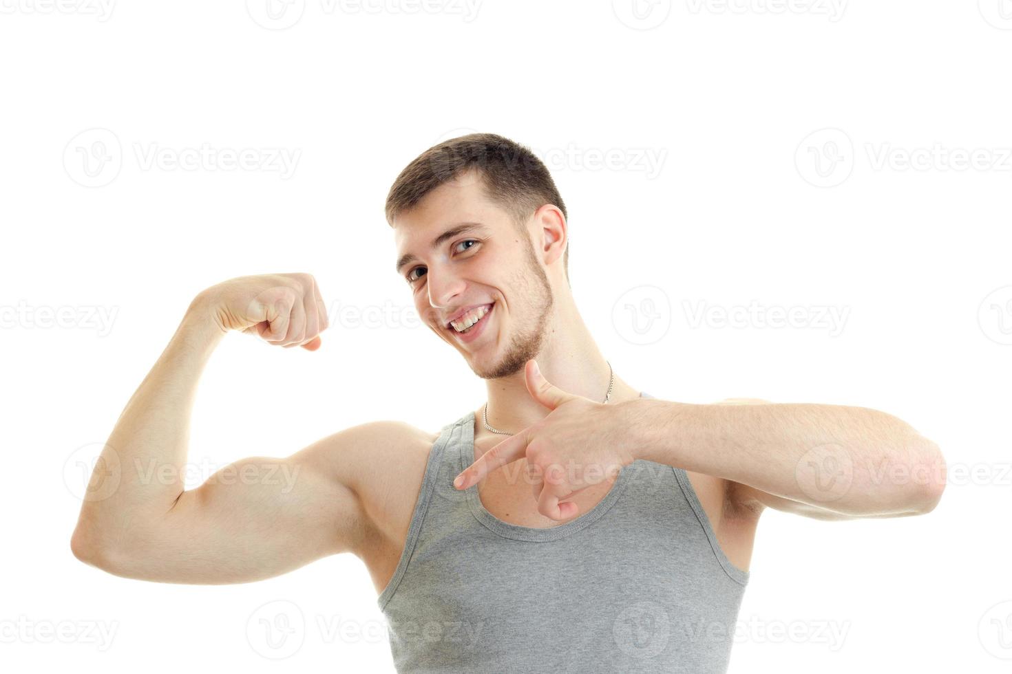 hilarious Sports Guy shows his muscle on hand close-up photo