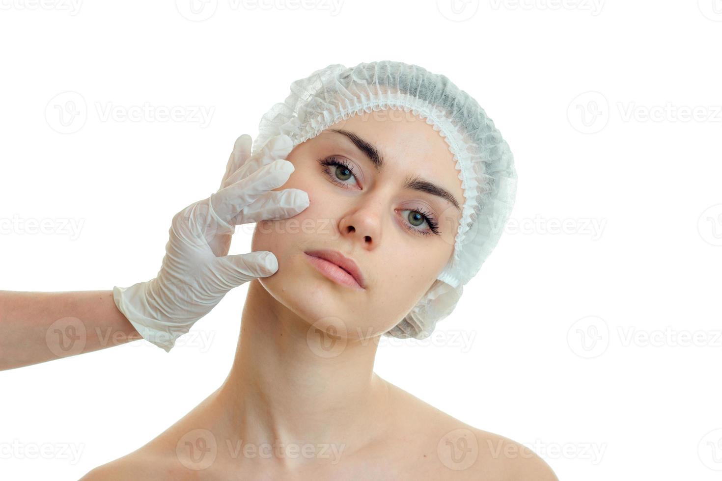 close-up portrait of a young pretty girl in a medical doctor Hat photo