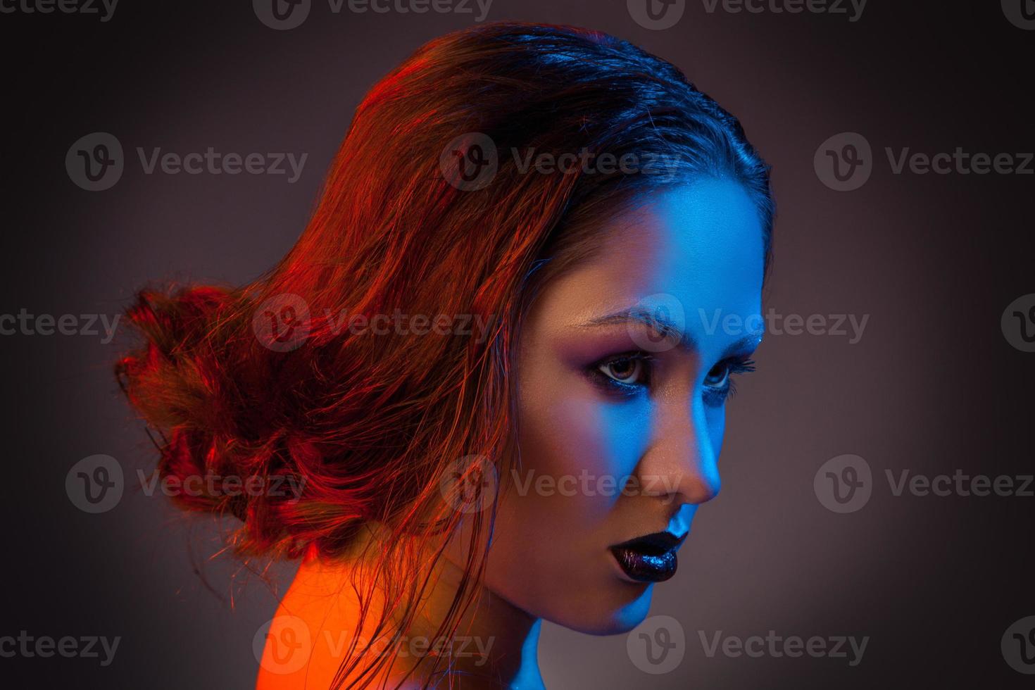 Attractive female looking away in studio photo