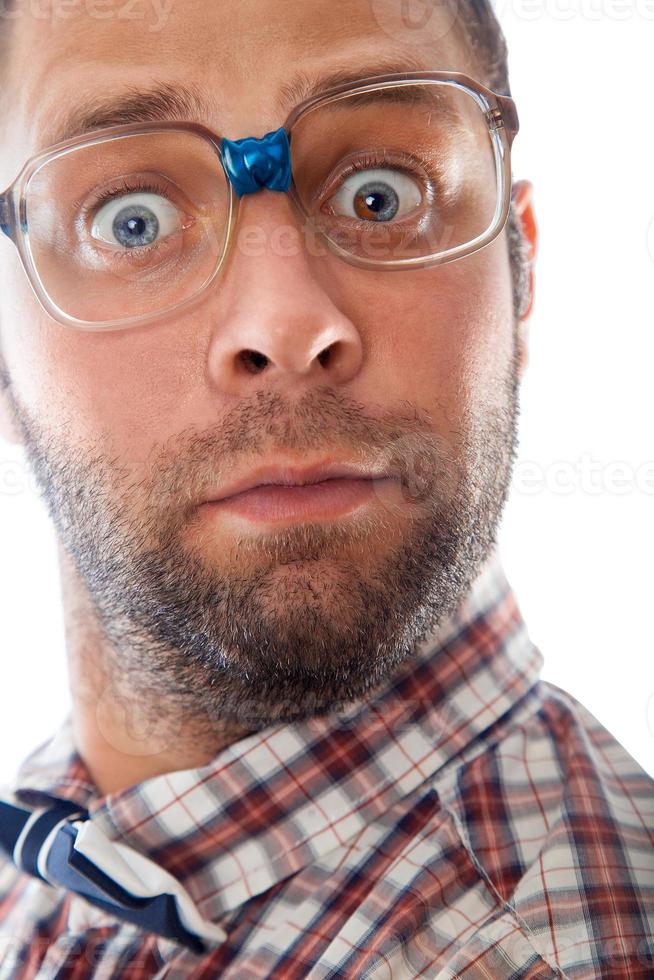 Close up portrait of surprised elegant geek in glasses photo