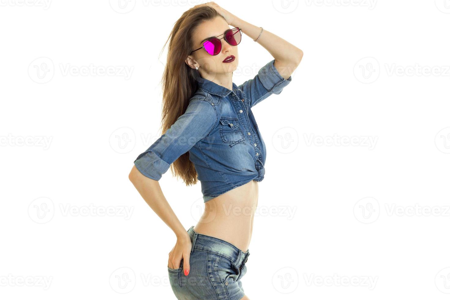 cute young bruntte in denim clothes and sunglasses photo