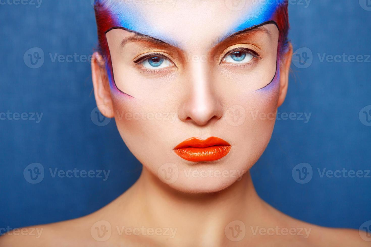 Horizontal portrait of charming woman with creative make up photo