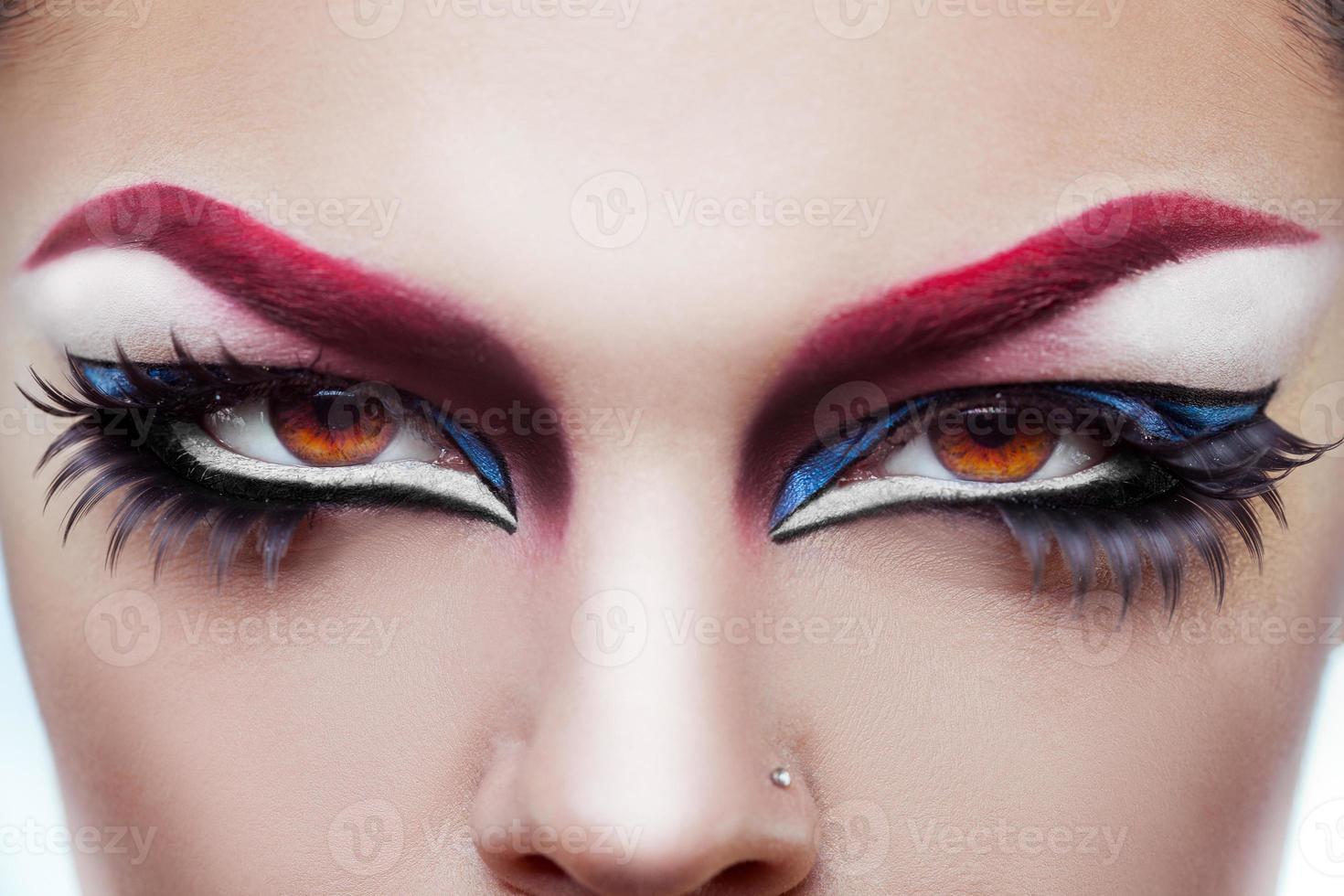 Close up photo of womans eyes with make up and healthy skin