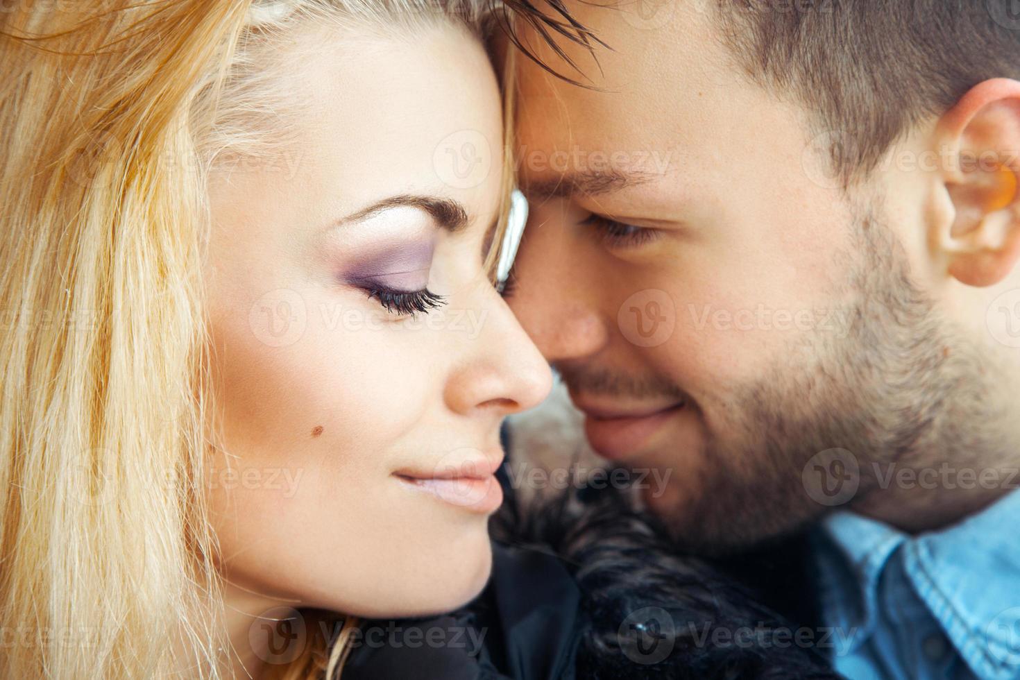 Lovers of young people enjoying each other's arms photo