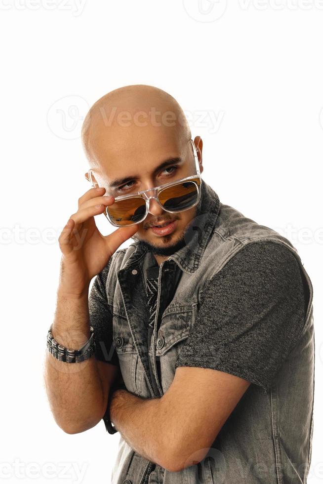 unshaved sensual man in sunglasses posing with opened mouth and looking aside photo