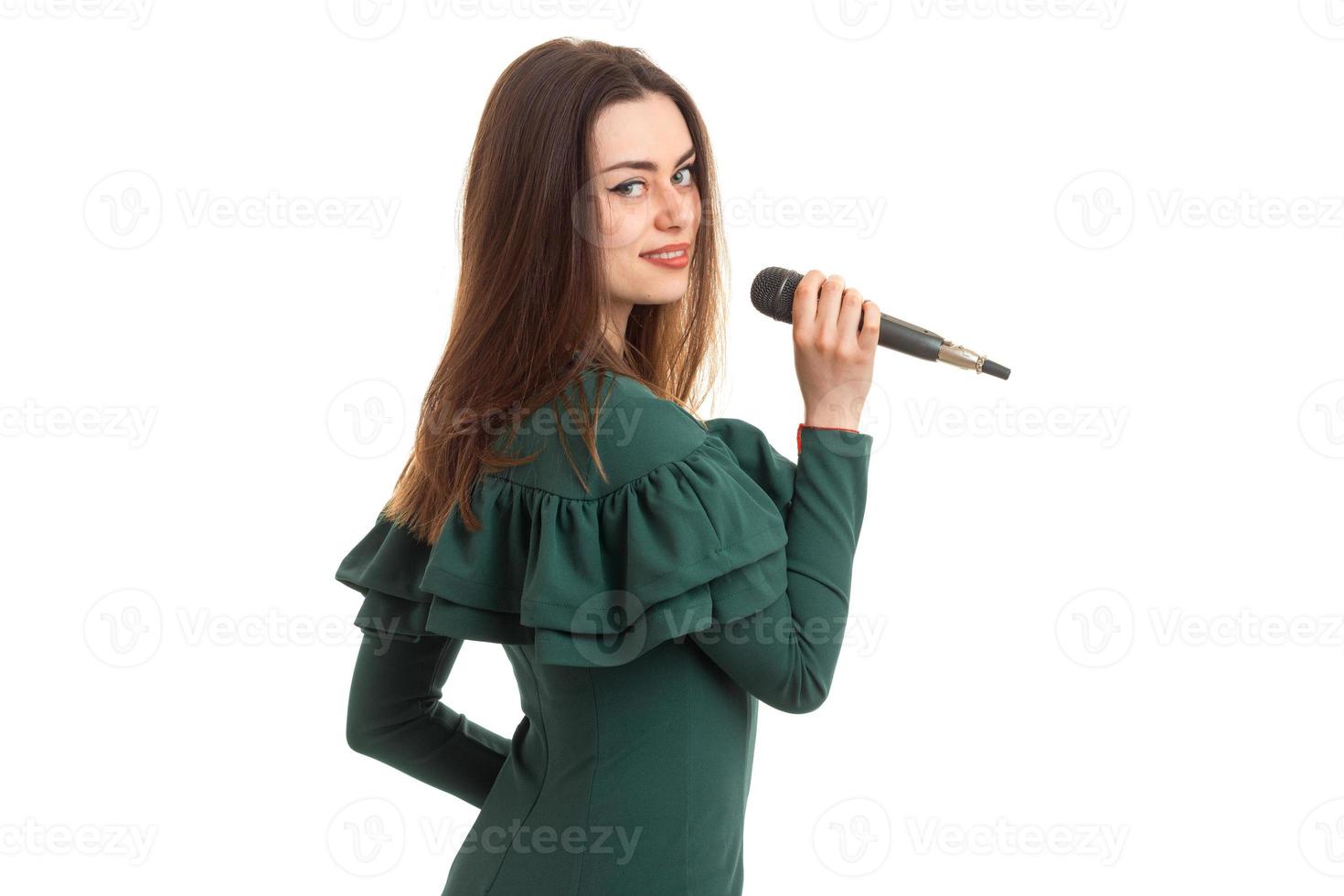 a charming young lady sings in karaoke and smiling photo