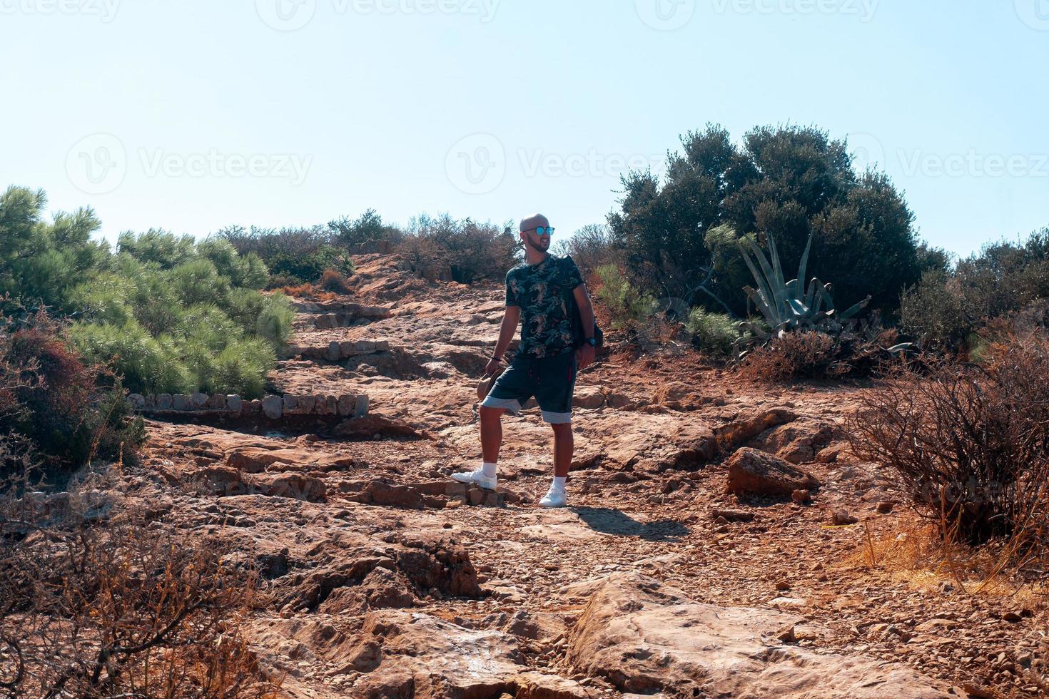 stylish Guy goes uphill during the day photo