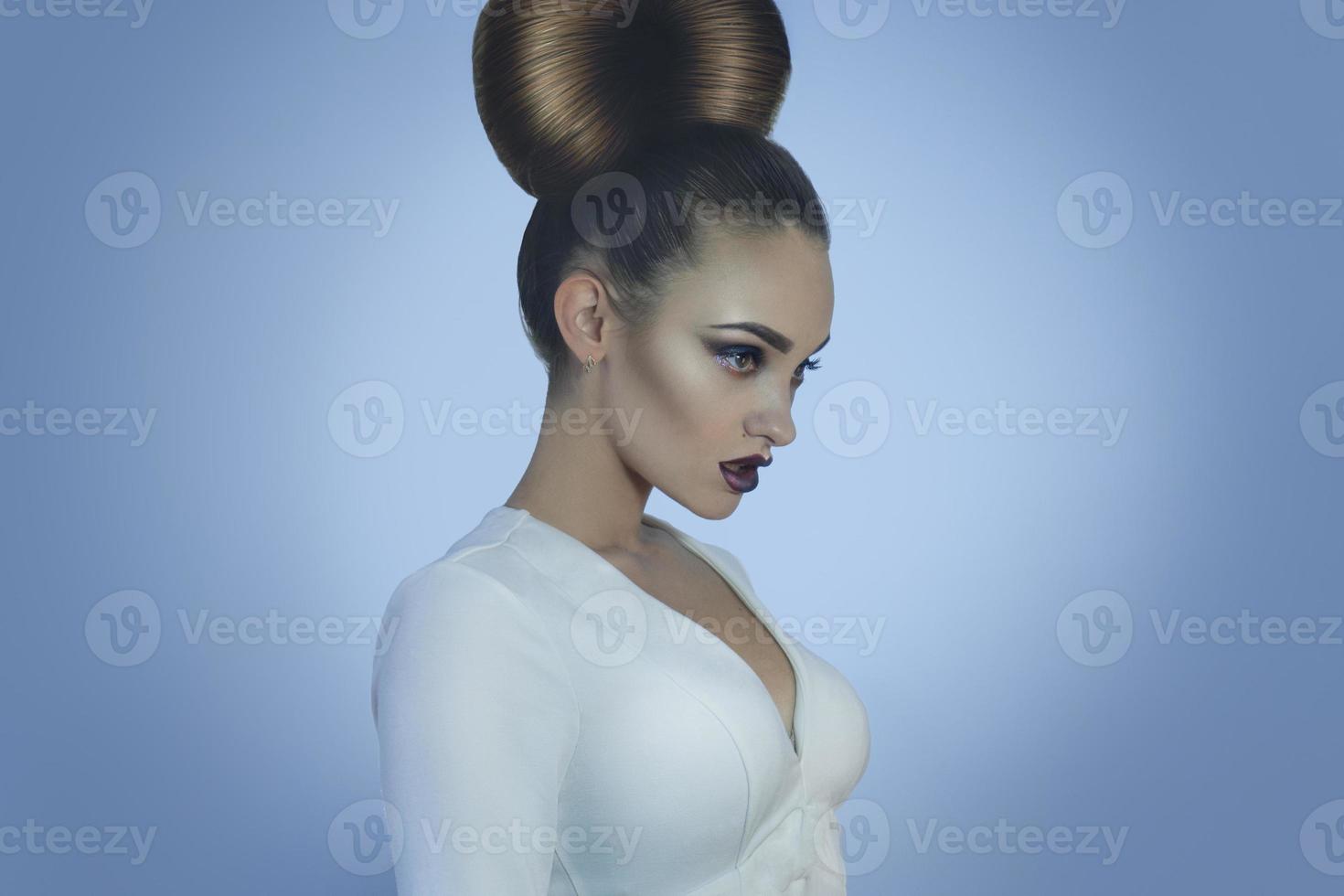 Glamour young lady with creative hairstyle and make up photo