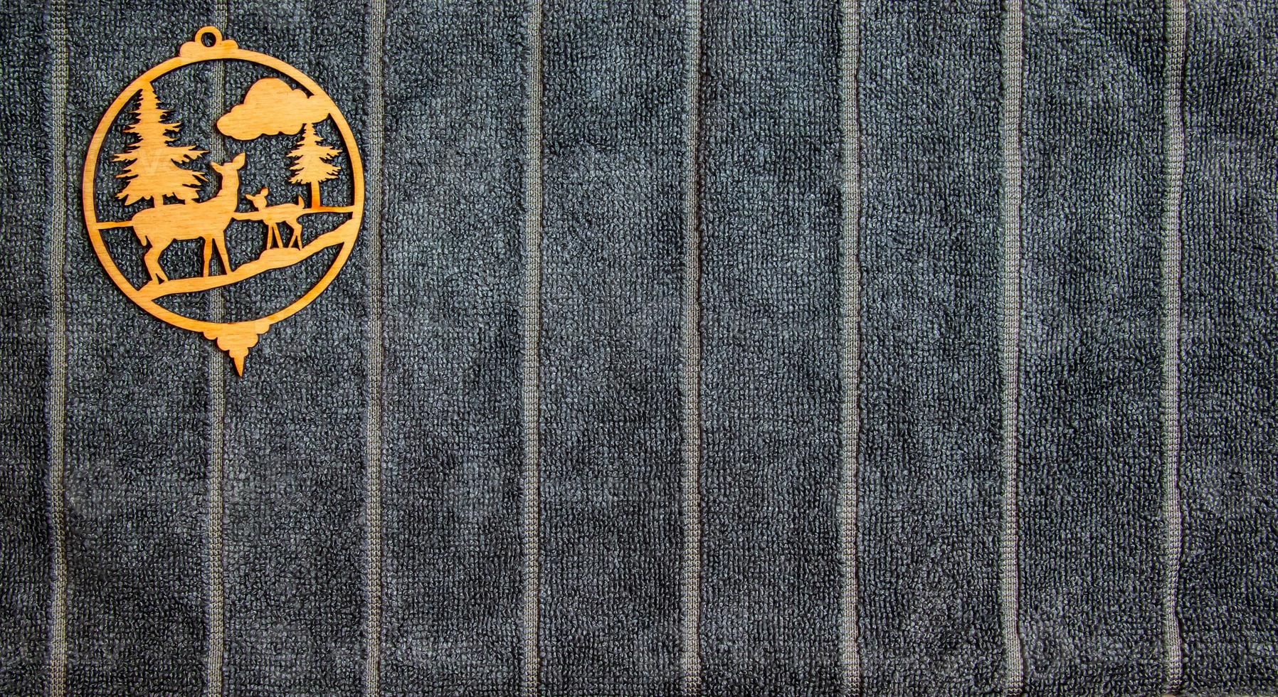 Gray texture of cotton microfiber towel. Christmas flat wood detail on background. Close-up of light natural cotton texture pattern for background photo
