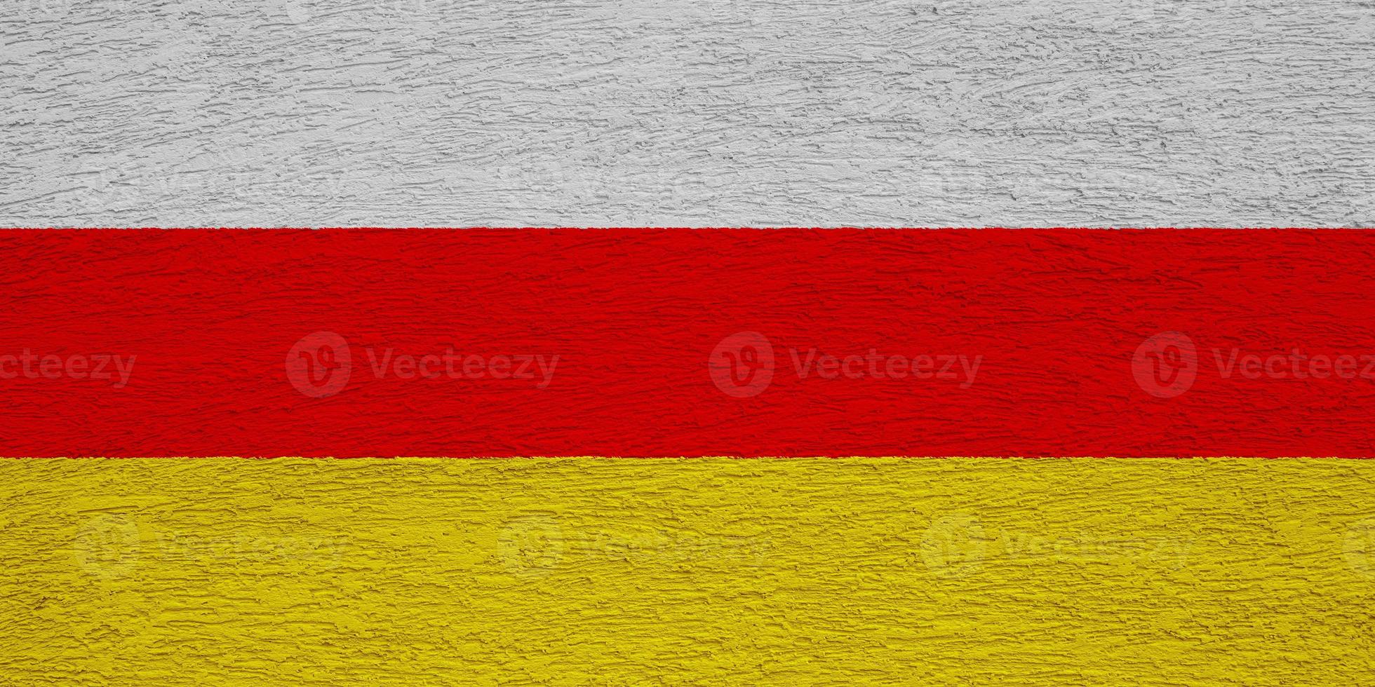 Flag of South Ossetia on a textured background. Concept collage. photo