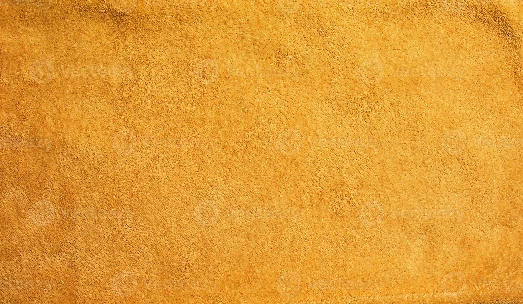 Yellow terry cloth for towels. Yellow fabric and texture concept. Close up terry cloth towel. photo