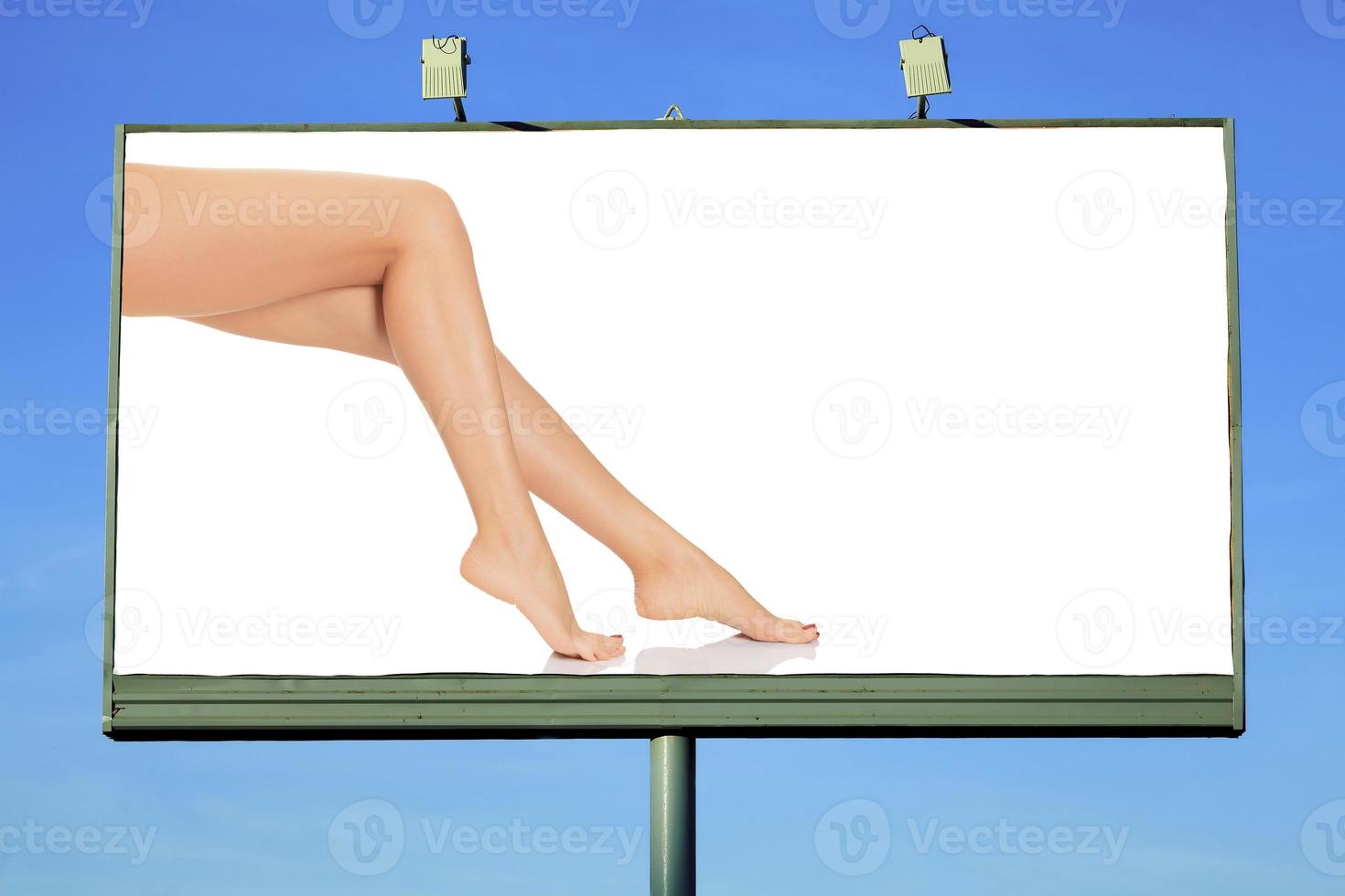 Street billboard with female legs and place for your message photo