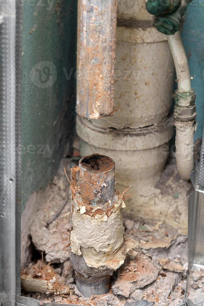 Old water pipe clogged with rust photo