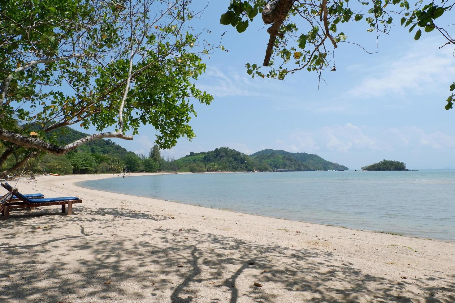 Natural beautiful beach at Phuket, Thailand. White beach, blue sky. with beach chair in from of beach photo