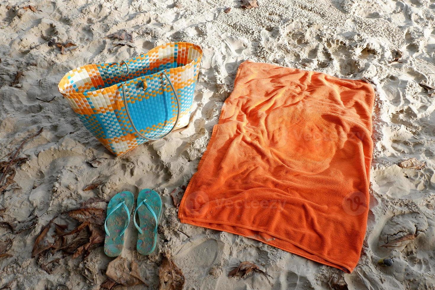 Beach accessories for woman sunbath, orange, blue and green color photo