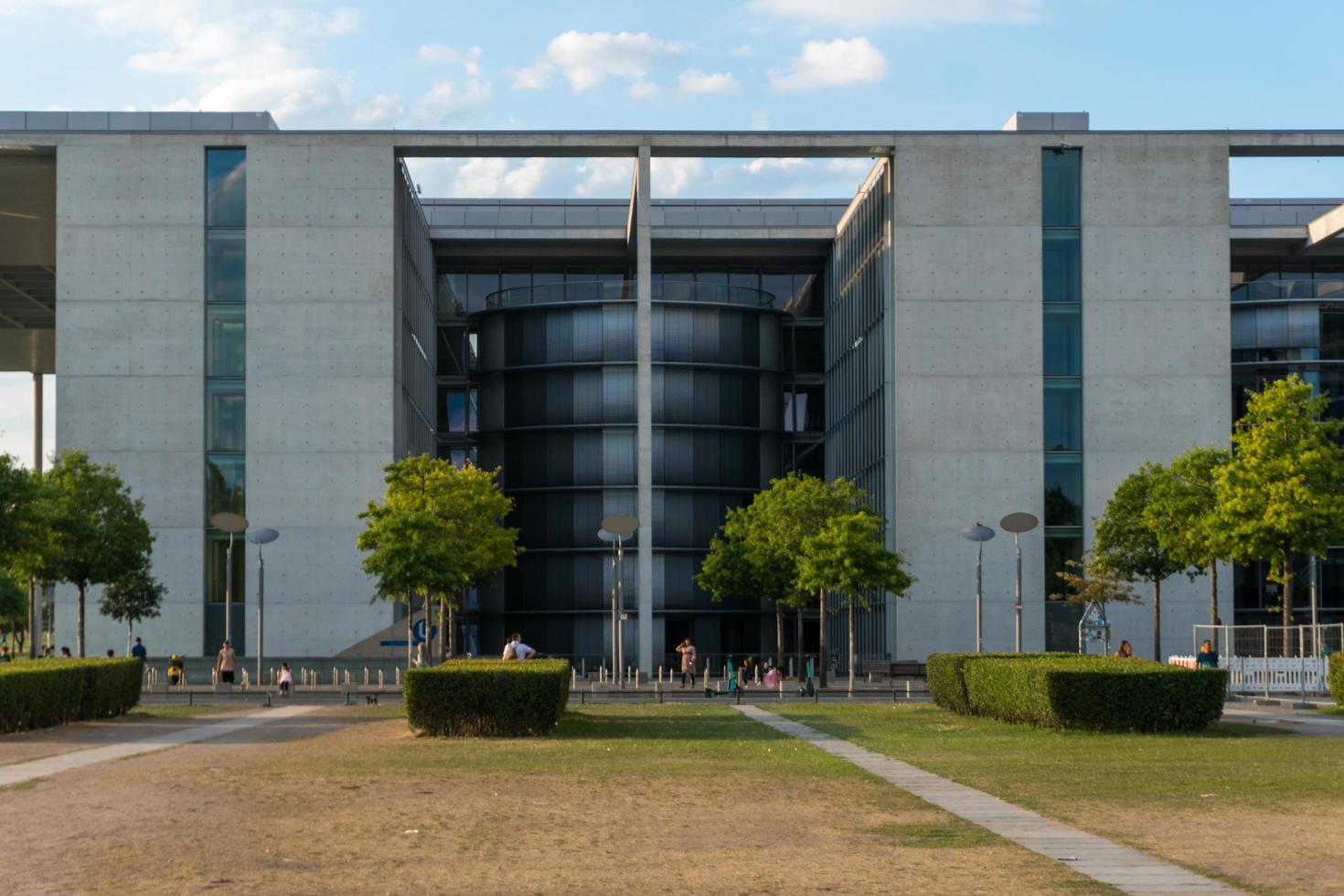 Berlin, Germany-august 8, 2022-People stroll on the Paul-Lobe-Allee near the Bundestag on a sunny day photo