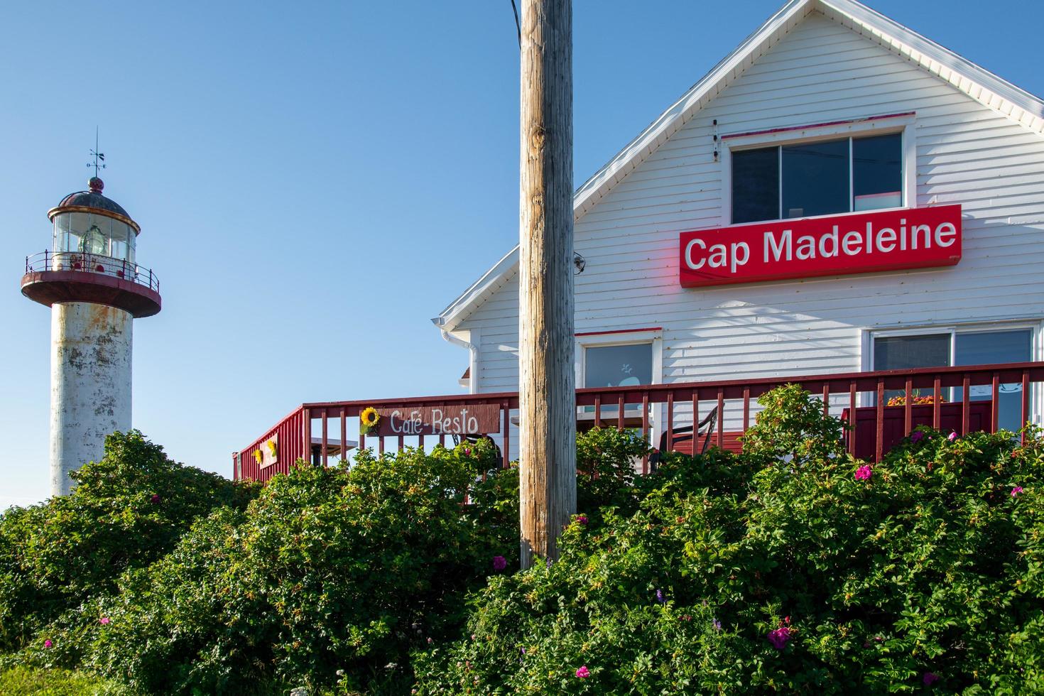 La Matre, Canada - August 9, 2015-View of the Phare de Cap Madeleine, one of Gaspesie's many iconic lighthouses during a sunny day photo