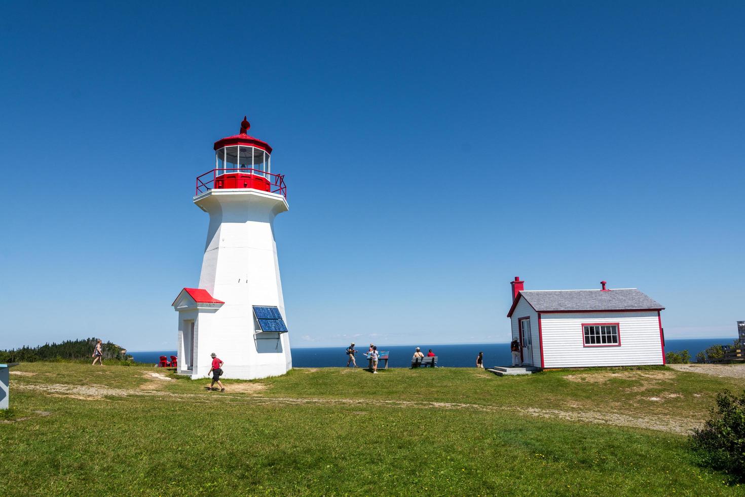 Gaspesie peninsula, Canada - August 9, 2015-View of the Phare de Cap Gaspe, one of Gaspesie's many iconic lighthouses during a sunny day photo