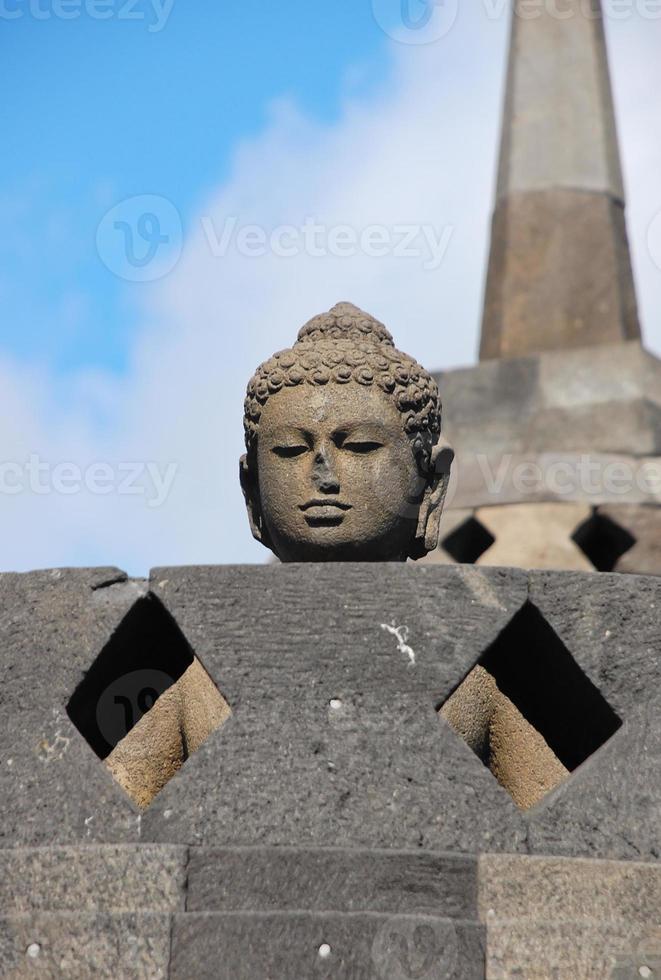 Buddha statue in Borobudur stupa photo