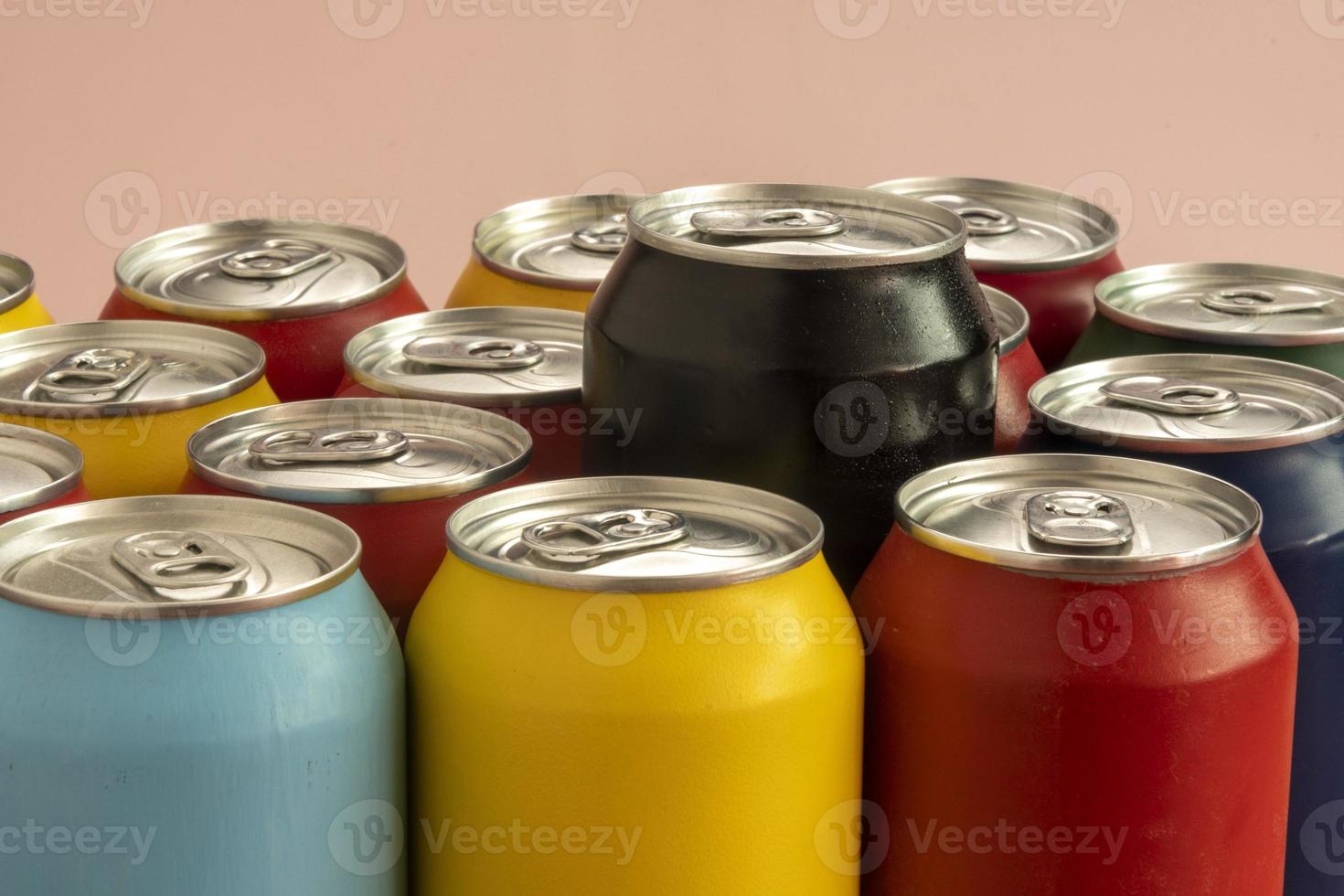 Soda cans for conceptual use representing that of calorie intake and obesity with a black can sticking out of the middle photo