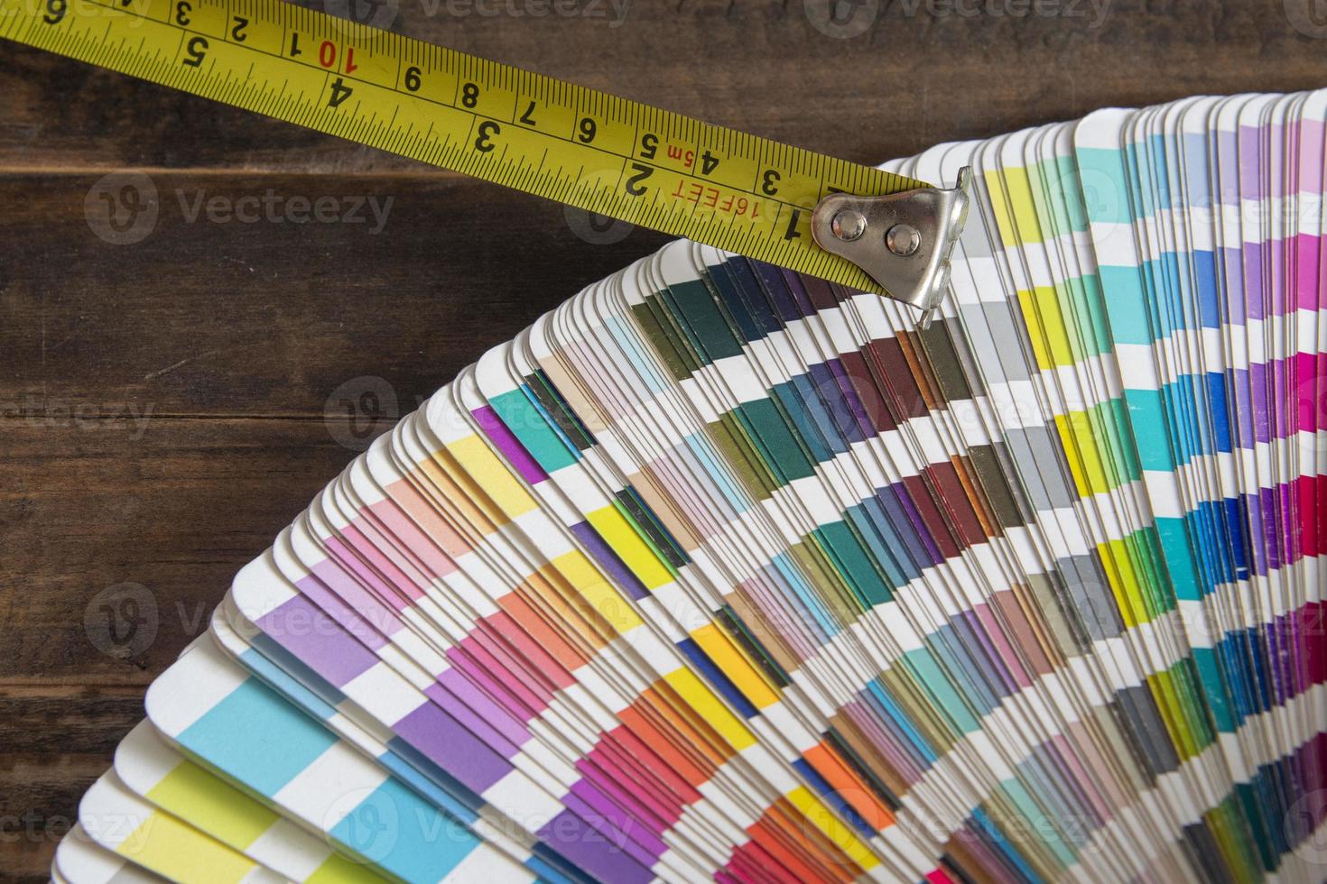 Color swatches used in graphic arts, with a measuring tape used in construction photo