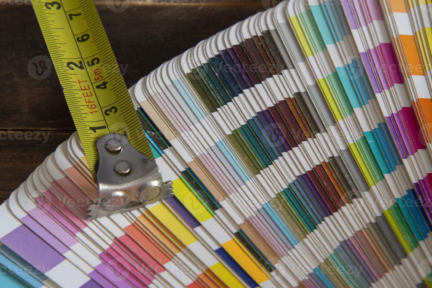 Color swatches used in graphic arts, with a measuring tape used in construction photo