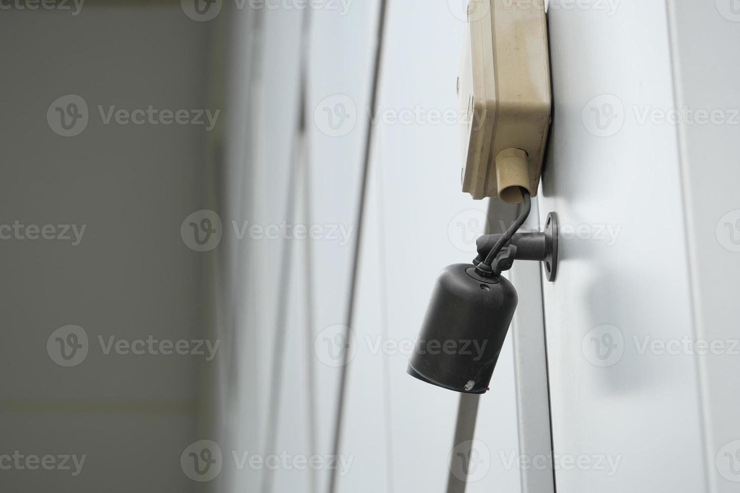 CCTV security camera operating outdoor photo