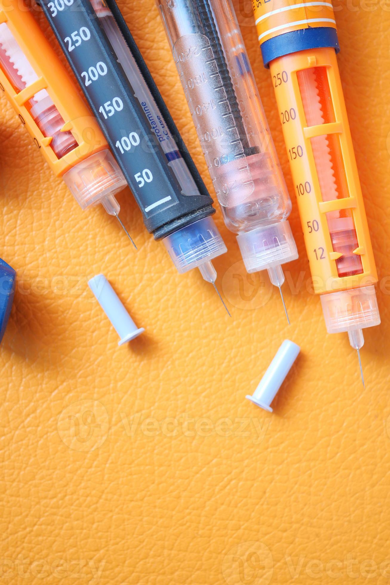 Insulin pens on orange background, 16554644 Stock Photo at Vecteezy