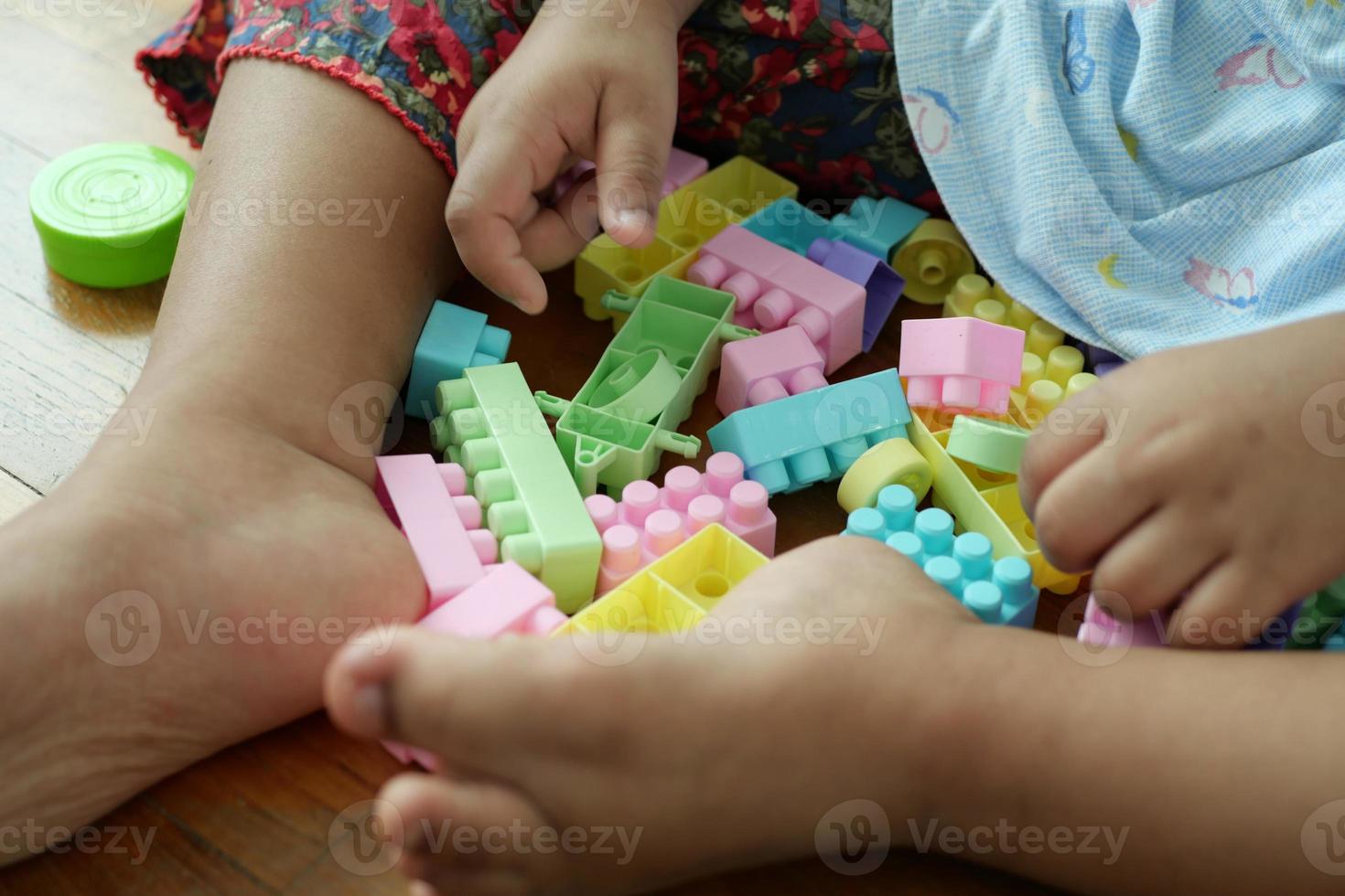 colorful building blocks on wooden table, close up photo