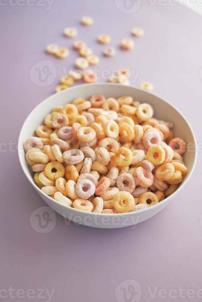 close up of colorful cereal corn flakes in a bowl photo