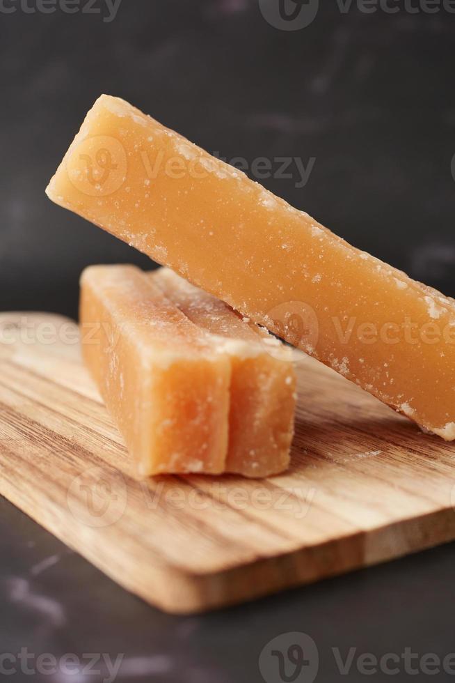Jaggery traditional cane sugar cube on table photo