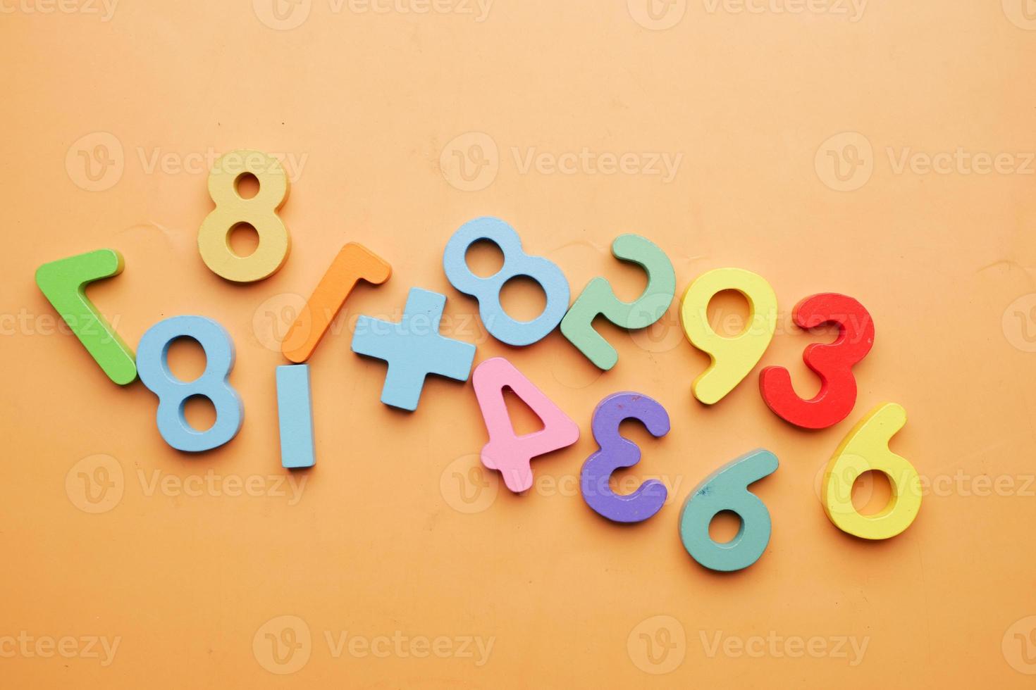 colorful plastic letters on white background, close up photo