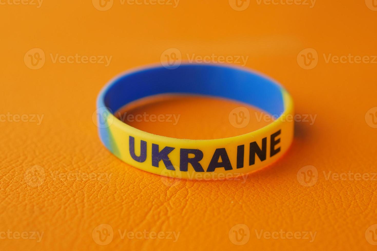 blue and yellow wristband , colors of flag of Ukraine. photo